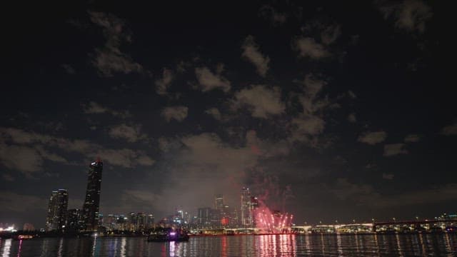 Firework Display Over the City at Night