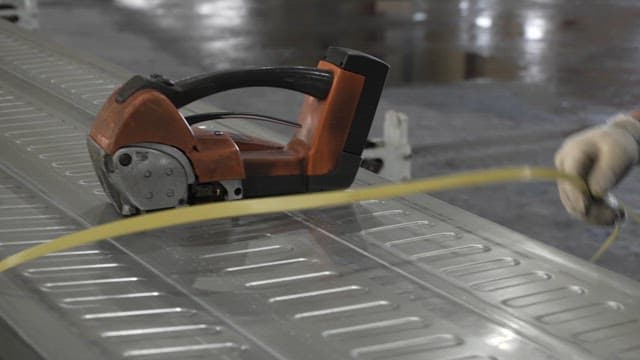 Metal sheet being cut with a power tool