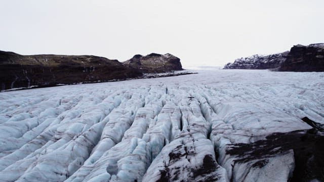 Vast glacier stretching between mountains