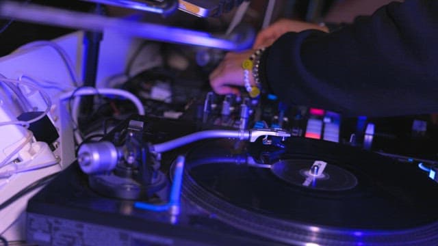 DJ mixing music on a turntable