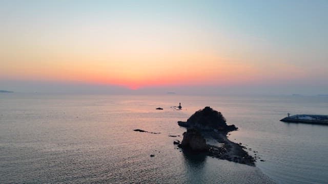 Sunset over the Sunset with the Silhouette of a Small Island