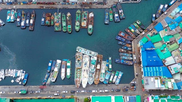 Aerial View of Docked Ships at a Busy Port