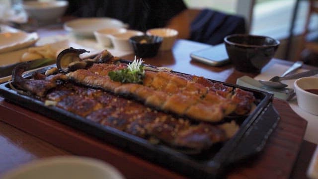 Grilled Eel Served at a Restaurant Table