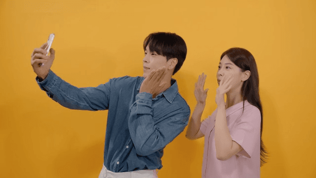 Man and a woman taking intimate selfies in various poses