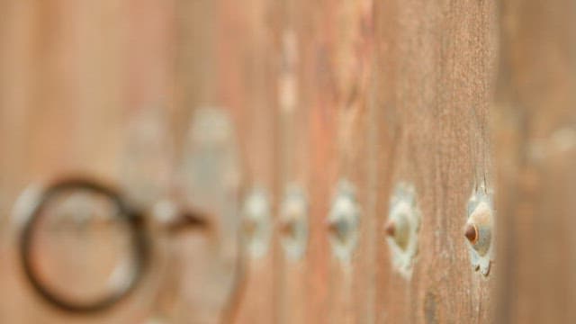 Close-up of a wooden door and handle of an old traditional Korean house