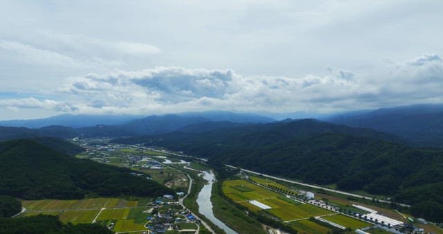 View of a rural with mountains and fields