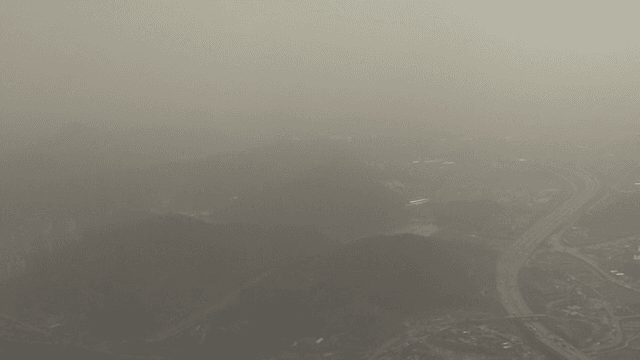 Dense Cityscape Shrouded in Haze Fog