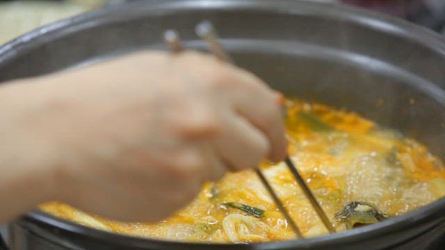 Kimchi picked up from spicy chicken hotpot