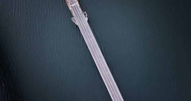 Bridge spanning over calm river