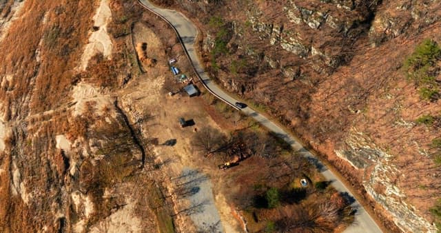 A winding road through a rugged landscape