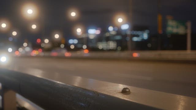 Night scene on a bustling city highway with blurred lights of vehicles