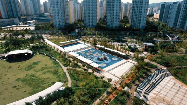 City park with playground and skyscrapers