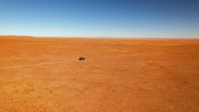 Vehicle Driving in a Barren and Vast Desert