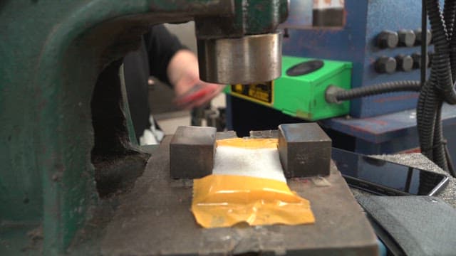 Person working with metal tools indoors