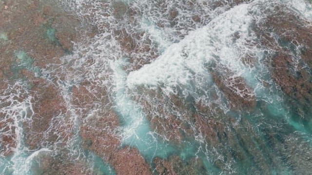 Waves crashing on a sandy beach