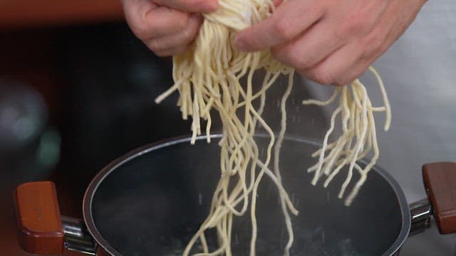 Boiling Noodles in a Pot of Boiling Water