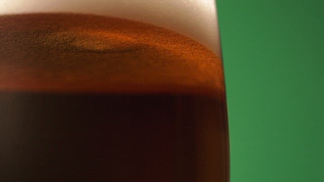 View of beer glass with bubbles rising