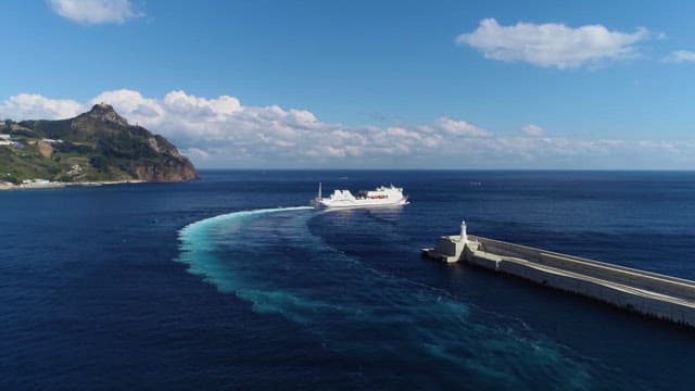 Ferry Going Forward to the Blue Sea Near the Island
