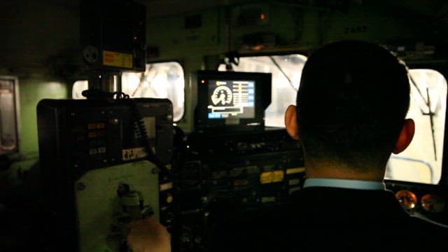 Train Driver Operating Controling Train in Control Compartment
