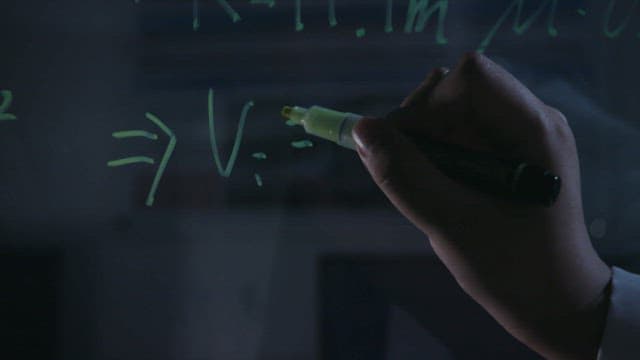 Hand writing equations on a transparent board