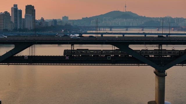 Train crossing a bridge in the city