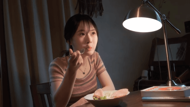 Woman enjoying a meal indoors
