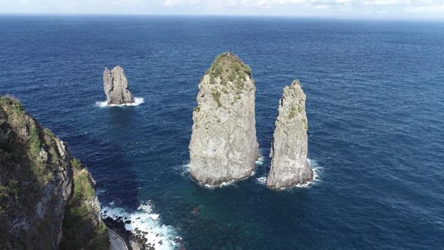 Majestic Rocky Pillars Rising from the Ocean