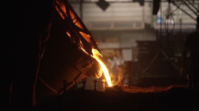 Molten metal being poured in a foundry