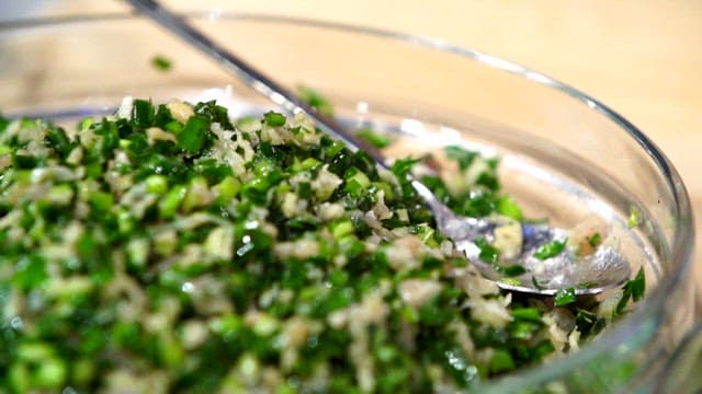 Chopped green vegetables in a glass bowl
