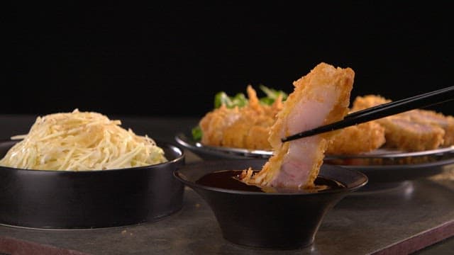 Tonkatsu dipped in sauce with cabbage