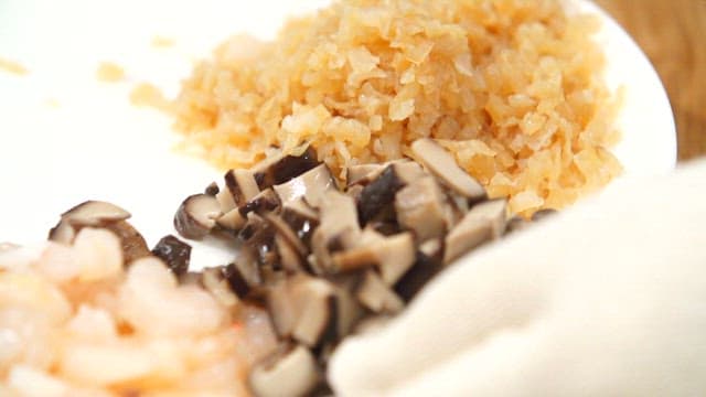 Chopped ingredients on a white plate