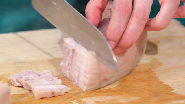 Preparing Meat on a Wooden Cutting Board