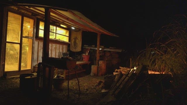 Cozy cabin with warm lighting at night