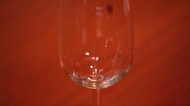 Red wine being poured into a glass