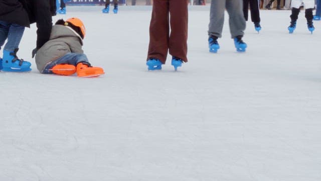 Children learning to ice skate