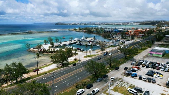 Yacht Anchored on the Coast of a Leisurely Resort Town