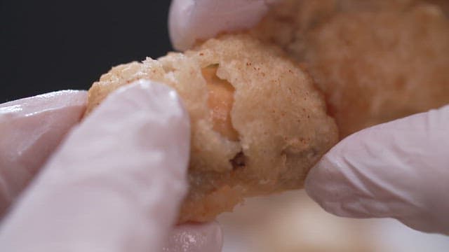 Showing the inside of crispy fried mussels