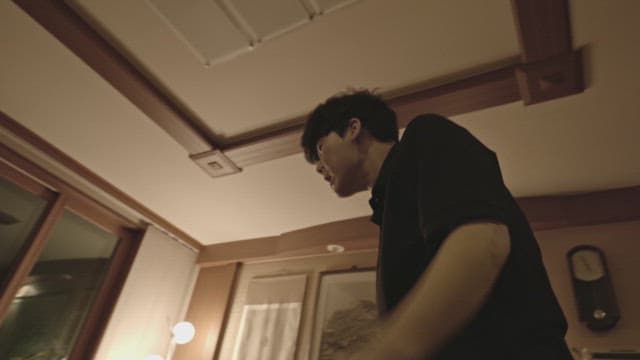 Person breathing heavily at home