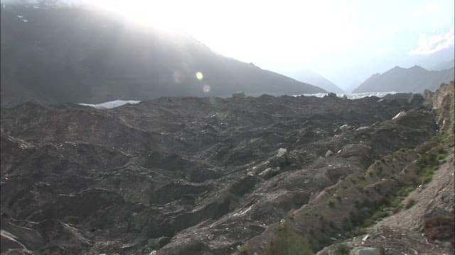 Majestic Spantik Gold Peak Under Sunlight