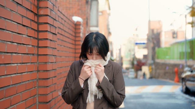 Student walking on the street in winter