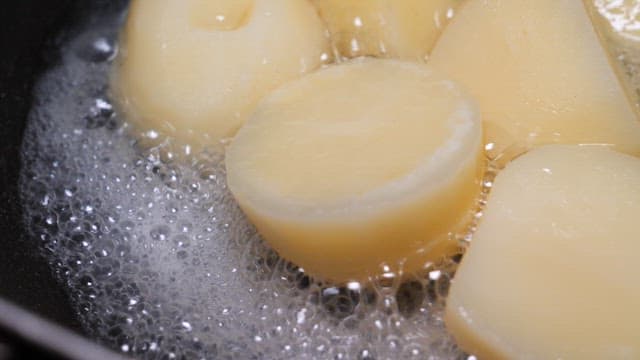 Boiling potatoes in a pot