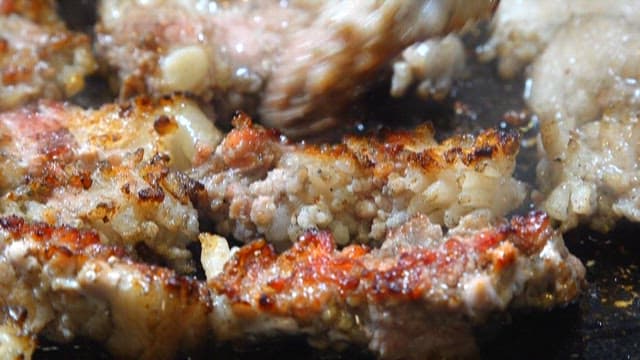 Sizzling Meat on a Hot Grill