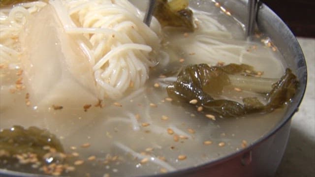 Bite of delicious and cold radish noodles
