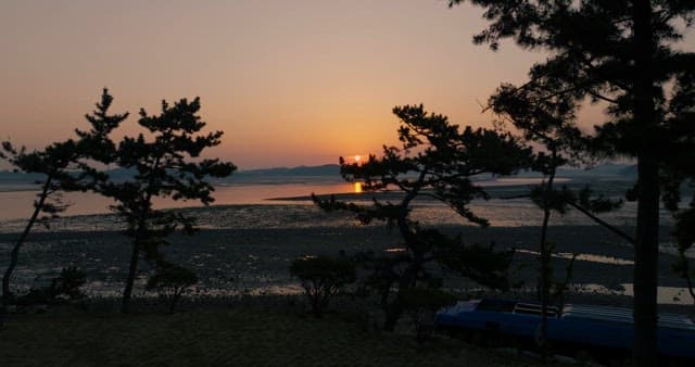 Sunset over a Serene Coastal Landscape