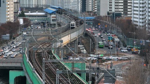 Subway Passing over a Bridge over a Busy City