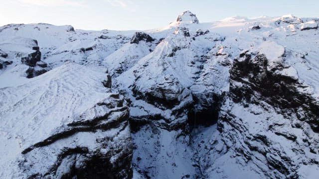 Snow-covered mountains with a deep gorge