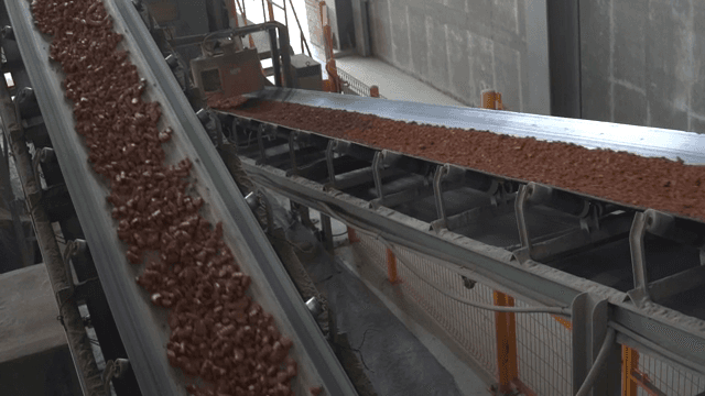 Conveyor belt transporting soil