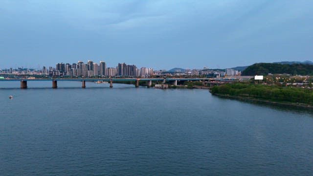 City skyline with a bridge over a river