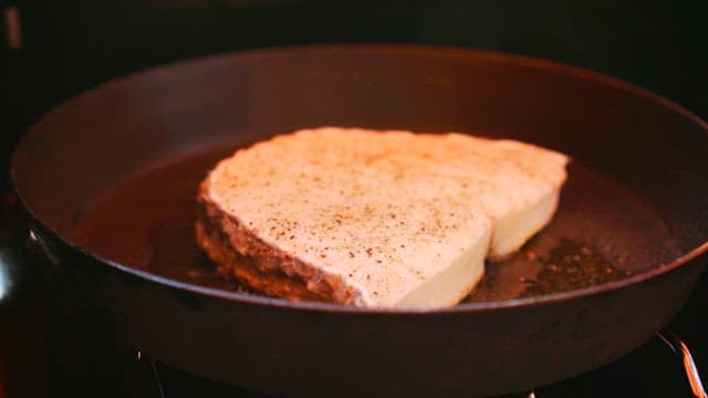 Fish steaks grilled in a hot oiled pan