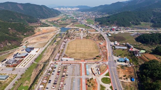 View of a village with surrounding mountains